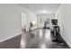 Recreation Room with hardwood floor, TV, exercise bike, and treadmill at 3949 Glenview Club Ln, Duluth, GA 30097