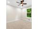 Comfortable bedroom with carpet, ceiling fan, and a window view to an exterior at 4043 Chedworth Way, Stone Mountain, GA 30083