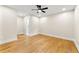 Bright bedroom featuring hardwood floors, ample natural light, and a ceiling fan at 4043 Chedworth Way, Stone Mountain, GA 30083