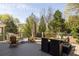 Inviting deck with outdoor furniture, dining set, and lush green surroundings at 513 Boulevard Se, Atlanta, GA 30312