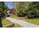 View of the spacious backyard with a long gravel driveway leading to a detached garage at 513 Boulevard Se, Atlanta, GA 30312