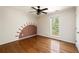 Bright bedroom with hardwood floors, natural light from window and a unique accent wall design at 513 Boulevard Se, Atlanta, GA 30312