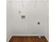 Empty laundry room with washer hookups, wire rack, and wood-look flooring at 513 Boulevard Se, Atlanta, GA 30312