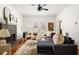 Inviting living room featuring a stylish fireplace, hardwood floors, large windows, and a comfortable sofa at 513 Boulevard Se, Atlanta, GA 30312