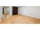 Spacious living room with hardwood floors featuring a Murphy bed and closet offers versatile living space at 513 Boulevard Se, Atlanta, GA 30312