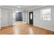 Inviting living room with hardwood floors, glass French doors, and a window allows for ample natural light at 513 Boulevard Se, Atlanta, GA 30312