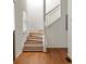 Entryway featuring a hardwood staircase with white railings and light-filled windows at 513 Boulevard Se, Atlanta, GA 30312