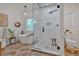 Bright bathroom features a soaking tub, glass-enclosed shower, and elegant fixtures at 1421 Hendon Rd, Woodstock, GA 30188
