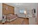 Charming bedroom featuring a rustic wood accent wall and stylish decor at 1421 Hendon Rd, Woodstock, GA 30188