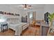 Bedroom with neutral decor, ceiling fan, and a cozy rattan hanging chair at 1421 Hendon Rd, Woodstock, GA 30188