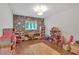 Playroom with gray wall with flower pattern, laminate flooring, and colorful toys at 1421 Hendon Rd, Woodstock, GA 30188