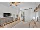 Bedroom showcasing neutral tones, modern furniture, and a barn door closet at 1421 Hendon Rd, Woodstock, GA 30188