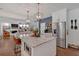 Modern kitchen with a large marble island and stainless steel appliances overlooks the comfortable living area at 1421 Hendon Rd, Woodstock, GA 30188