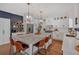 Bright kitchen features a large island with marble countertop, stylish pendant lighting, and stainless steel appliances at 1421 Hendon Rd, Woodstock, GA 30188
