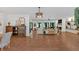 Spacious living room with hardwood floors, stylish furniture, and built-in shelving at 1421 Hendon Rd, Woodstock, GA 30188