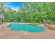 Backyard features a large pool with an attached jacuzzi and an outdoor seating area at 1421 Hendon Rd, Woodstock, GA 30188