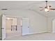 Large carpeted bedroom featuring high vaulted ceilings and two entry doors at 238 Linford Dr, Locust Grove, GA 30248