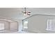 Large carpeted bedroom featuring high vaulted ceilings and a ceiling fan at 238 Linford Dr, Locust Grove, GA 30248