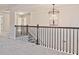 View of the second story hallway with decorative wrought iron railings and balusters at 238 Linford Dr, Locust Grove, GA 30248