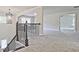 View of the second story hallway with a decorative chandelier at 238 Linford Dr, Locust Grove, GA 30248