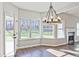 Bright living room with large windows, fireplace, and access to outdoor space at 238 Linford Dr, Locust Grove, GA 30248