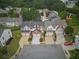 An aerial view of well-maintained homes showcasing driveways and landscaping in a suburban neighborhood at 3601 Gainesway Trce, Duluth, GA 30096