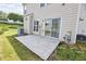 Back patio with sliding glass door leading to yard with grass and AC unit on the side of a house at 3601 Gainesway Trce, Duluth, GA 30096