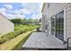 Home backyard featuring a concrete patio, siding, and greenery at 3601 Gainesway Trce, Duluth, GA 30096