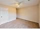 Bright bedroom with neutral walls, carpet, and a ceiling fan at 3601 Gainesway Trce, Duluth, GA 30096