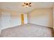A neutral bedroom with carpet flooring and a ceiling fan at 3601 Gainesway Trce, Duluth, GA 30096