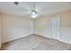 Bright bedroom featuring carpet floors, neutral walls, and two closets at 3601 Gainesway Trce, Duluth, GA 30096