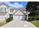 Attractive townhome with two-car garage, well-maintained lawn and partial brick facade for added curb appeal at 3601 Gainesway Trce, Duluth, GA 30096