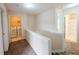 Upstairs hallway with access to the laundry room and full bathroom at 3601 Gainesway Trce, Duluth, GA 30096