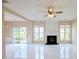 Spacious living room with modern fireplace, sleek tile floors, and sliding door access to the outdoors at 3601 Gainesway Trce, Duluth, GA 30096