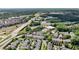 Stunning aerial view of townhomes, surrounded by trees, highways, and commercial businesses at 4676 Ivygate Se Cir, Atlanta, GA 30339