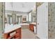 Well-lit bathroom with vintage wallpaper, double vanity, and soaking tub offers a unique design at 4676 Ivygate Se Cir, Atlanta, GA 30339