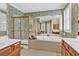 Elegant bathroom features shower, large tub, and vanity; perfect for relaxation at 4676 Ivygate Se Cir, Atlanta, GA 30339