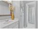Bright bathroom with neutral walls, white vanity, and tiled shower is both stylish and functional at 4676 Ivygate Se Cir, Atlanta, GA 30339