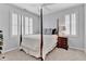 Bedroom with great natural light, plush carpeting, and shuttered windows provide comfort and privacy at 4676 Ivygate Se Cir, Atlanta, GA 30339