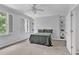 Bedroom features sunlit windows, built-in shelving, and neutral tones, creating a serene atmosphere at 4676 Ivygate Se Cir, Atlanta, GA 30339