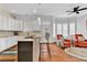 Bright kitchen with white cabinets, granite countertops, an island with seating, and breakfast nook at 4676 Ivygate Se Cir, Atlanta, GA 30339