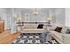 Sophisticated living room with a stylish area rug, hardwood floors, and elegant decor at 4676 Ivygate Se Cir, Atlanta, GA 30339