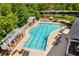 Community pool with lounge chairs, pergolas, and mature trees creating a relaxing environment at 4676 Ivygate Se Cir, Atlanta, GA 30339