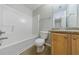 This bathroom offers a tub and shower combination with a vanity sink and a toilet at 4844 W Park Cir # 4844, College Park, GA 30349