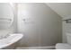 Powder room featuring a pedestal sink, an elongated toilet, and updated fixtures at 4844 W Park Cir # 4844, College Park, GA 30349