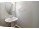 Powder room featuring a pedestal sink, an elongated toilet, and updated fixtures at 4844 W Park Cir # 4844, College Park, GA 30349