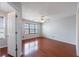 Bright bedroom with hardwood floors, ceiling fan, and window with blinds at 4844 W Park Cir # 4844, College Park, GA 30349