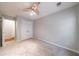 This carpeted bedroom features neutral walls, trim, and a double-door closet at 4844 W Park Cir # 4844, College Park, GA 30349