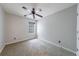 This bedroom features neutral walls, carpet, a window, and a ceiling fan at 4844 W Park Cir # 4844, College Park, GA 30349
