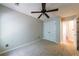 This carpeted bedroom features neutral walls, trim, and a double-door closet at 4844 W Park Cir # 4844, College Park, GA 30349